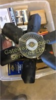 Box of GM truck parts fuel filter, fan, gaskets