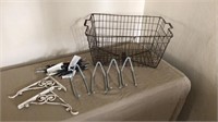 Wire basket, bungee straps, bike hooks and plant