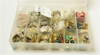 Plastic divided case full of costume jewelry