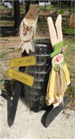 Two wooden yard ornaments: scarecrows welcome,