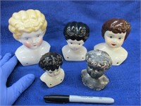 5 old doll heads (4 porc. - 1 metal)