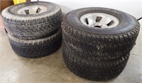 Four Firestone Tires with Rims