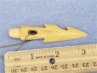 A fossilized ivory harpoon pendent, approx. 3 1/4"