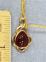 .925 silver ruby pendant with 18" chain with yello