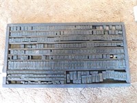 Antique printer's tray with wooden blocks, blocks