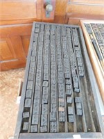 Antique printer's tray with wooden blocks, blocks