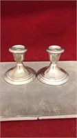 two sterling candle holders