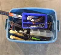 Tote bin filled with assorted tools
