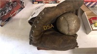 Two catchers mits and old softball