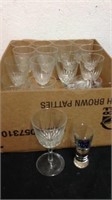 Group of wine glasses and one shot glass