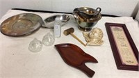 Silverplated serving items with wood dish wall