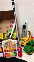 Group of kids toys includes John Deere tractor