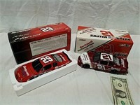 2 diecast racing cars new in box