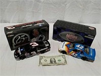 2 die cast collectible race cars both with