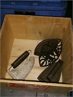 Wooden box with old irons