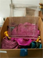 Box of textiles and lucite case