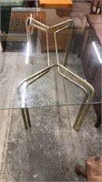 Glass top table, 59 inches long by 35 inches wide