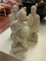 A set of three statues