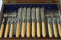 Antique mahogany cased canteen of fish cutlery,