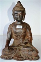 Cast iron seated Buddha,