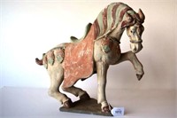 Chinese painted pottery figure of prancing horse,