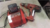 Milwaukee power drill with battery and charger