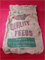 Five Burlap Quality Feeds Bags