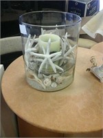 Big glass candle holder with lots of seashells