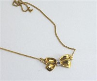 Fine 8ct yellow gold necklace and bow pendant