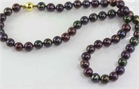 Black freshwater pearls with 9ct gold clasp