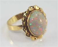Good 9ct yellow gold and solid white opal ring