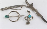 Two silver and turquoise brooches