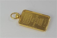 Gold pendant marked 20g 999.9 gold