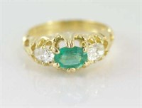 18ct yellow gold, oval emerald & 2 diamond ring