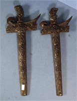 Pair carved wood Indonesian kris daggers