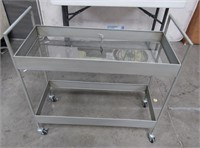 43 - NEW SILVER ROLLING CART (MISSING BOTTOM GLASS