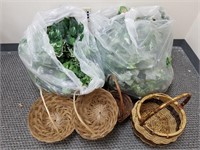 LOT OF BAGGED FAUX GREENERY AND BASKETS