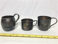 Three silver plated cups.