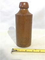 R. White stoneware bottle.