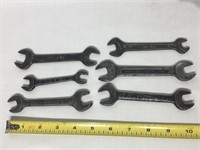 SIx antique wrenches.