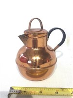 Small copper pitcher.