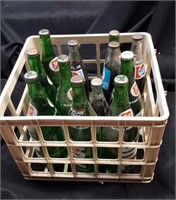 Crate of 13 vintage pop bottles