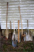group of scoops, shovel, picks, rake & handle