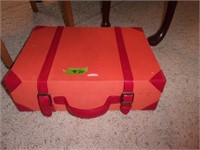 Orange with red stripes suitcase