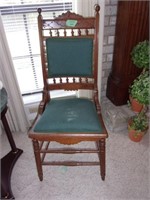 Eastlake chair with green cloth