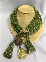 Multi strand faceted jade bead necklace with sever