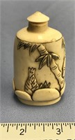 3" Fossilized ivory perfume bottle with relief car