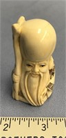 2.75" Fossilized ivory netsuke of a man with color