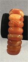 An orange and cream marbled agate stretch bracelet