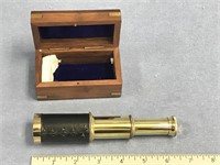 A miniature telescope in a wood box with brass acc